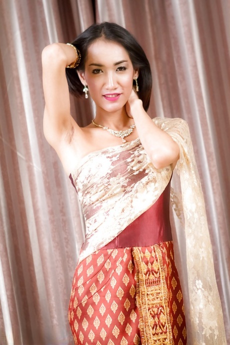Skinny Asian tranny Om whacking off shedick while toying bumhole